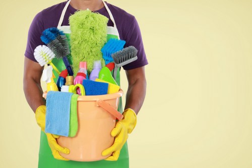 Carpet cleaning technician preparing equipment with safety focus in Harringay