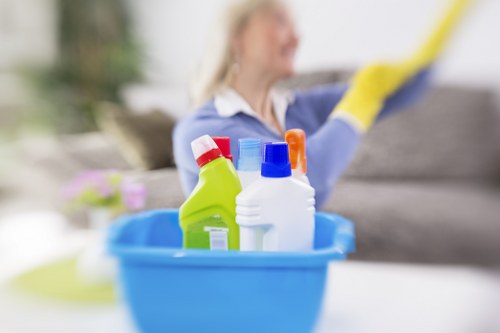 Bathroom cleaning for a Harringay household focusing on taps, sink, and tiles